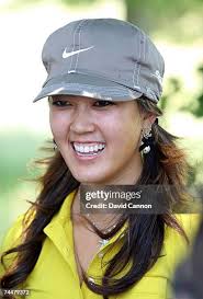 Physical therapist Leanne Quinn massages the wrist of Michelle Wie... News  Photo