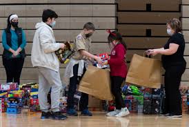 Goodfellows hands out gifts, warm clothing to local children in need