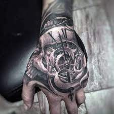 50 Unbelievable Tattoos For Men Inconceivable Ink Design Ideas Hand Tattoos For Guys Skull Hand Tattoo Tattoo Designs Men