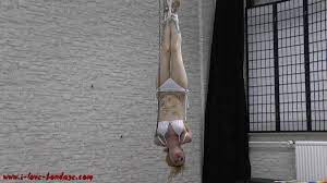 BoundHub - Girl hangs upside down