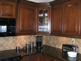 Pin By Lindsay Small On For The Home Kitchen Cabinets With Black Appliances Kitchen Tile Backsplash With Oak Brown Cabinets