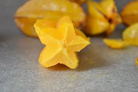 On a cutting board, lay down the star fruit vertically. How To Eat Star Fruit Food Com