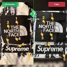 Step 3 Fake Vs Real Supreme Tnf Baltoro Arm Tag On The Side Hand Emoji Fake Tnf Jacket