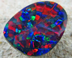 Black opal with a body tone of n1 with this pattern can be worth around $5,000 to $30,000 per carat on the opal fields. Learn About The Rare Harlequin Pattern Opal Opal Auctions