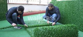 Use a carpet stretcher or a carpet kicker. How To Install Grass Fence Panels