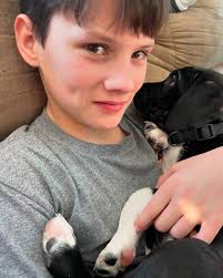 Who rescued who? Meet Max, our newest family member and the best snuggle  buddy around! Big paws, floppy ears, and a heart full of love—welcome home,  Max! 🐾🖤🤍