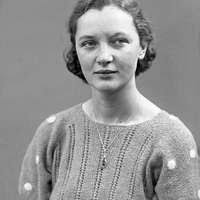 Woman in pea picker's camp. California. "I seen our corn dry up and blow  over the fence back there in Oklahoma."