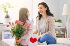 Maybe you would like to learn more about one of these? Happy Mother S Day Child Daughter Is Congratulating Mom And Giving Her Flowers Tulips Mum And Girl Smiling Family Holiday And Togetherness Stock Photo Picture And Royalty Free Image Image 119476813
