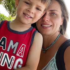 What are some tv wall design ideas for a living room with a vaulted ceiling  and earthy tones?