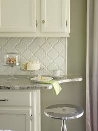 A beautiful quartz countertop follows the lines of the white cabinetry and the light blue island. Beveled Arabesque Tile Glossy White Design Ideas