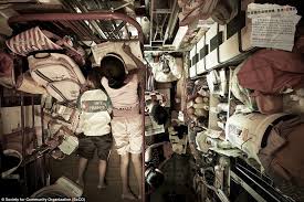 Hong Kong S Human Battery Hens Claustrophobic Images Show How Slum Families Squeeze Their Lives Into The Tiniest Apartments Hong Kong House Hong Kong Micro Apartment