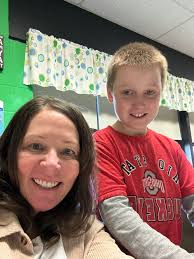 Mrs. Voytko and Liam working hard