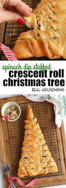 This delicious spinach and artichoke dip is baked inside a dough ball ring making it a fun festive appetizer for the holidays or any party. This Spinach Dip Stuffed Crescent Roll Christmas Tree Is S Fun Way To Serve Up Your Favorite Cheesy Sp Best Christmas Appetizers Holiday Recipes Christmas Food