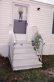 Steel brackets are bolted to the foundation using concrete anchors. Concrete Steps Century Group