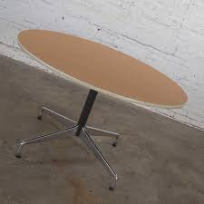 Maybe you would like to learn more about one of these? Eames Herman Miller Round Table Universal Base Wood Grain Laminate Top For Sale At 1stdibs