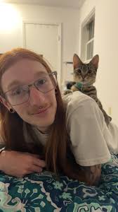 my baby cat kiki is convinced that she's a parrot