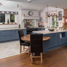 Black metal counter chairs sit at a peninsula topped with a beige counter in this kitchen with white cabinetry beautifully contrasted with black appliances. 75 Beautiful Kitchen With Blue Cabinets And Black Appliances Pictures Ideas July 2021 Houzz