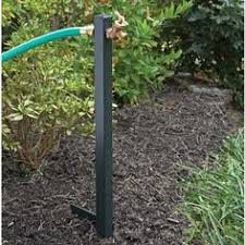The two foot tall yard butler outside spigot extender works as a perfect outlet for your lawn, garden, or yard hose because it puts your outside hose exactly where you need it. 12 Outdoor Spigot Ideas Garden Hose Outdoor Gardens Lawn And Garden