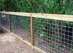 It has wooden posts but the center is constructed of cattle paneling. 27 Cheap Diy Fence Ideas For Your Garden Privacy Or Perimeter Cheap Fence Backyard Fences Cattle Panels