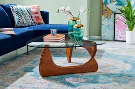 This iconic mid century design comes in many models, but only a few manage to grasp the genius simplicity behind the triangular glass plate and the sculptural wooden base. Matt Blatt Noguchi Coffee Table Replica Walnut Matt Blatt