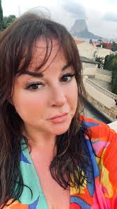 My twin sister recently passed away ans I have not many pics of us together  only when we were younger. Can anyone make these photos so it's us two  together? She is