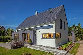 Das Massive Einfamilienhaus Vettel Beweist Eine Moderne Archietektur Trotz Satteldach Durch Den Wintergar Baumeister Haus Moderne Scheune Haus Architektur Haus