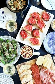 Small plates of food shared among party guests. How To Host A Tapas Party Part One Cake N Knife