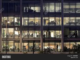 Many of us desire a dedicated study room when purchasing a new home, or explore the possibility of if you're not an office worker then perhaps you need a dedicated spot to sort the household bills and correspondence. Late Night Overtime In A Modern Office Building Image Stock Photo 13076861