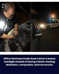 Officer fixes driver's headlight