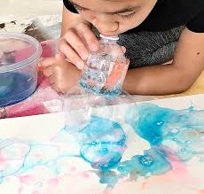 The extra water will cause the watercolors to flow more easily over the surface of the paper. Recycled Bottle Bubble Art With Kids Hello Wonderful