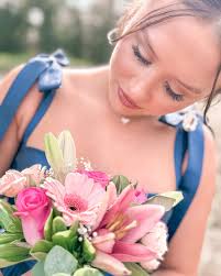 A girl and her flowers!! I think she liked them!! #hoco2024  #handheldbouquet #texashomecoming #texarkanaflorist #texarkanaflorists  #customfloraldesigner #theflowerroomflorist #notyourordinaryflorist