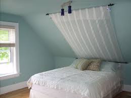 Finally We 39 Re Working On Our Tiny Little Bedroom We Have Very Dramatic Sloped Ceilings Attic Bedroom Small Sloped Ceiling Bedroom Slanted Ceiling Bedroom