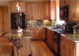 Black stainless appliances are less prone to smudges and fingerprints. Kitchen With Black Appliances Glazed Maple Cabinets Gray Marble Countertops And W Maple Kitchen Cabinets Kitchen Cabinets With Black Appliances Maple Kitchen