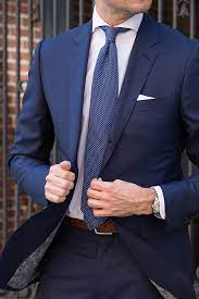 Your go to colors for a white shirt and navy blue suit would include a navy, red or burgundy tie. 13 Different Ties To Wear With A Blue Suit He Spoke Style
