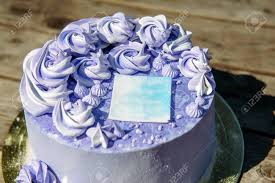 Check spelling or type a new query. Purple Birthday Cake With Cream Flowers On Wooden Background Close Up Wedding Sweets Blueberry Cake Decorated With Decorative Sticker Top View Stock Photo Picture And Royalty Free Image Image 147974642