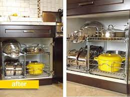 The industrial towel rod and hooks with 's' shaped are the most effective ones which take little space. Before After A Better Way To Organize Pots And Pans In The Cupboard Kitchn