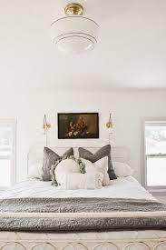 Beautiful wall sconces for an exquisite modern bedroom. Master Bedroom Makeover New Wall Sconces Liz Marie Blog