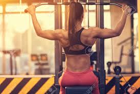 Check spelling or type a new query. Athletic Woman Using Machine For Pumping Back Muscles In Gym Back View Stock Photo Picture And Royalty Free Image Image 90307494