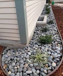 In this photo it is easy to see the harmony between the smooth river rock, blue fescue and silvered ipe. Landscaping With River Rock Best 130 Ideas And Designs Rock Garden Design Landscaping With Rocks Side Yard Landscaping