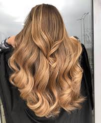 Medium brown hair with chestnut lowlights and caramel highlights, soft waves. 61 Trendy Caramel Highlights Looks For Light And Dark Brown Hair 2020 Update