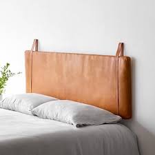 A headboard can add a luxurious look to your bedroom and can help tie the furniture in your room together. Pin By Meghan Nice On Slumber Leather Headboard Scandinavian Headboard Modern Bed Frame