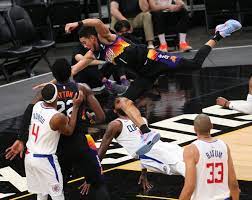Devin booker of the phoenix suns looks to play the ball against paul george of the la clippers during the second half of the nba game at phoenix suns arena on april 28, 2021 in phoenix, arizona. Rzzgueczhujfxm