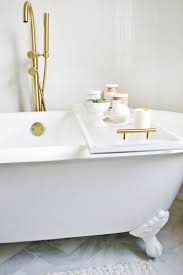 Just because you're taking a break from the world, doesn't mean you need to leave comfort and entertainment behind. Lucite Bathtub Caddy Diy A Beautiful Mess
