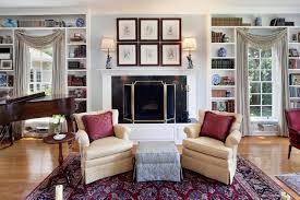 To balance the composition, i added a tall corner cabinet on the opposite side. Elegant Living Room Features Fireplace Built In Bookcases Baby Grand Piano Hgtv