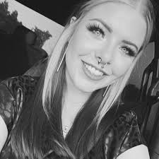 What are the symptoms of an ear infection in dogs?