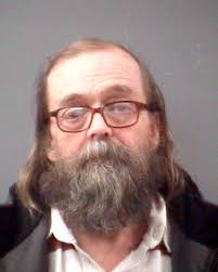 Kellett charged in dog shooting, break in