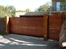 Ameristar's patented adaptrack cantilever gate conversion kit is a complete set of basic parts, hardware and accessories created to convert any gate or fencing panel into a smoothly sliding cantilever gate. Diy Sliding Gate Frame Sliding Gate Kits Timber Gates Wooden Side Gates Sliding Gate