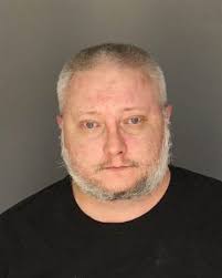 Dearborn man, 37, charged in shooting of another man's car