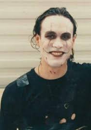 In The Crow just before Eric paints his face, he is sitting at the dresser  looking at memories of his life with Shelly, he pulls some pictures out of  a drawer and