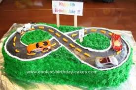 Top has two big foot trucks. Coolest Hot Wheels On The Road Kids Birthday Cake 79